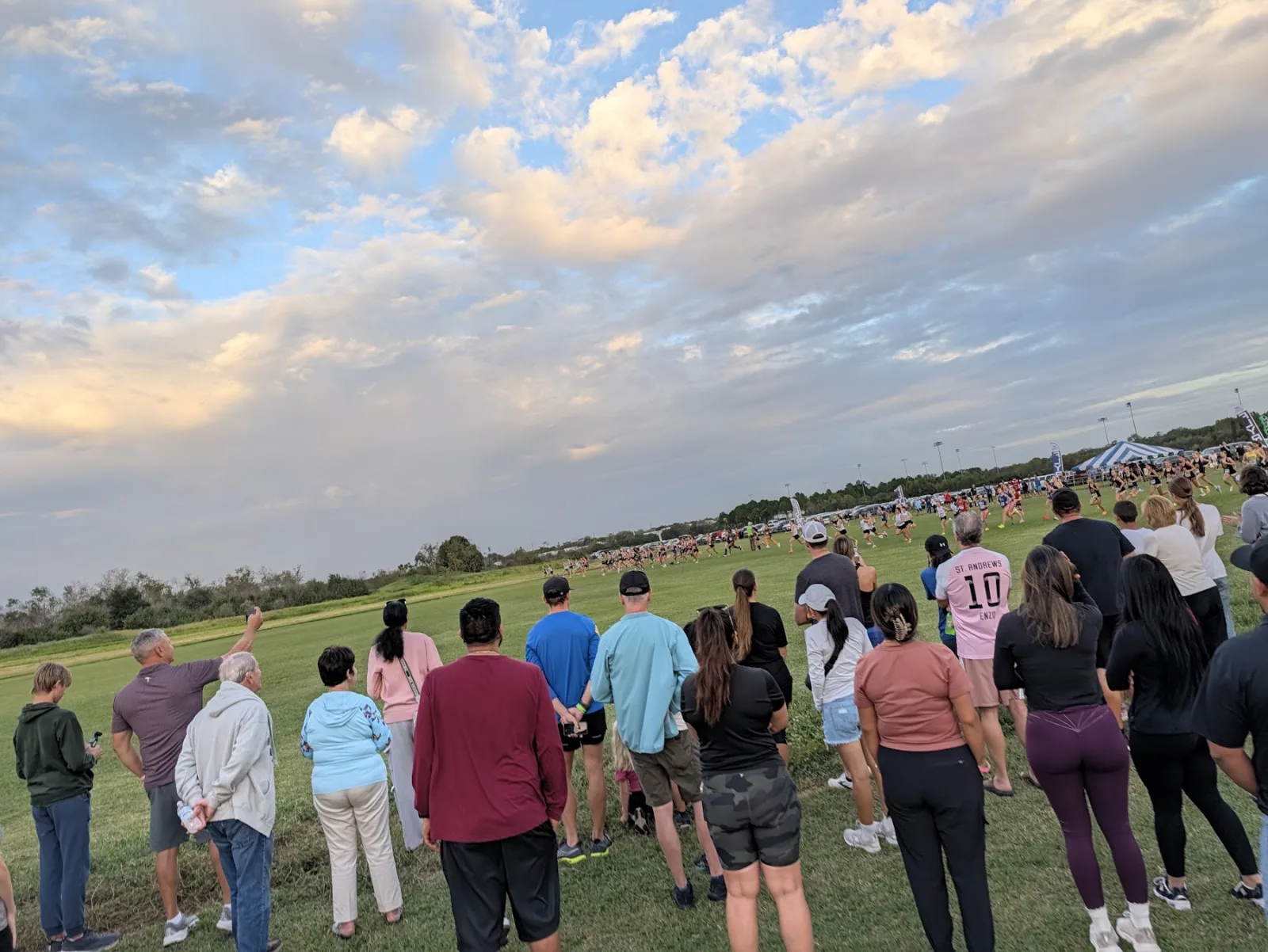 Spectators lining the course at Holloway Park in Lakeland as a middle school race starts at the 2026 FLYRA state cross country championships