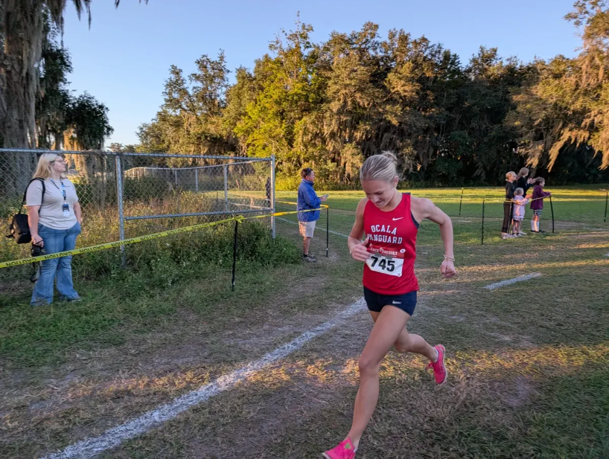 Vanguard freshman Annalise Hallick racing at the 2026 Marion Athletic Conference cross country championships at Belleview High School
